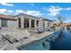 Stunning backyard pool with modern design elements, seating and an umbrella, perfect for outdoor relaxation at 20125 E Melissa Pl, Queen Creek, AZ 85142