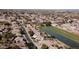 Panoramic aerial view of a serene neighborhood featuring varied homes, green spaces, and orderly streets at 2089 E Lynx Pl, Chandler, AZ 85249