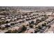 Scenic aerial view of a housing community showcasing numerous homes with well-manicured lawns and landscaping at 2089 E Lynx Pl, Chandler, AZ 85249