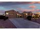 Spacious home exterior with a three-car garage and well-maintained landscaping at 2089 E Lynx Pl, Chandler, AZ 85249