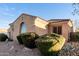 Tan home exterior featuring manicured landscaping and a welcoming architectural design at 2089 E Lynx Pl, Chandler, AZ 85249