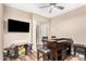 Game room featuring dark wood floors, a vintage arcade game, and a custom bar for entertaining at 2089 E Lynx Pl, Chandler, AZ 85249