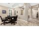 A relaxing game room featuring a tray ceiling, a poker table, and plantation shutters at 2089 E Lynx Pl, Chandler, AZ 85249