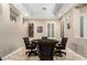 A relaxing game room featuring a tray ceiling, a poker table, and plantation shutters at 2089 E Lynx Pl, Chandler, AZ 85249