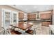 Bright eat-in kitchen boasting a spacious dining area and stainless steel appliances for seamless cooking at 2089 E Lynx Pl, Chandler, AZ 85249