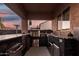 Outdoor kitchen with stainless steel grill, sink, and ample counter space, perfect for al fresco dining at 2089 E Lynx Pl, Chandler, AZ 85249