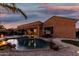 Sparkling pool with rock accents, adjacent to turf and lounging spaces provides backyard fun at 2089 E Lynx Pl, Chandler, AZ 85249