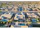 Overhead view of a neighborhood featuring beautiful backyards, pools, and manicured landscaping at 20981 E Watford Dr, Queen Creek, AZ 85142