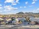 Stunning aerial view of a well-kept single Gathering home with mountain views and desert landscaping at 20981 E Watford Dr, Queen Creek, AZ 85142