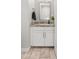 Modern powder room featuring a granite countertop, white cabinetry, and stylish fixtures creates a clean, functional space at 20981 E Watford Dr, Queen Creek, AZ 85142