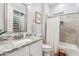 Bright bathroom features granite countertop, shower-tub combination, and storage, creating a relaxing and functional space at 20981 E Watford Dr, Queen Creek, AZ 85142