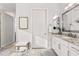 Bright bathroom featuring granite countertops, white cabinets, and tile floors at 20981 E Watford Dr, Queen Creek, AZ 85142