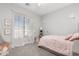 Bright bedroom with soft carpet, large windows, and custom decor creates a cozy, inviting space to rest and relax at 20981 E Watford Dr, Queen Creek, AZ 85142