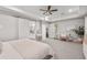 Large bedroom featuring a makeup vanity, large windows, and an ensuite bathroom at 20981 E Watford Dr, Queen Creek, AZ 85142