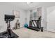 Home gym with carpet flooring, exercise equipment, and natural light provides a dedicated space for fitness at 20981 E Watford Dr, Queen Creek, AZ 85142