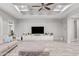 Stylish living room featuring a large TV, custom built-ins, and modern design elements at 20981 E Watford Dr, Queen Creek, AZ 85142