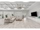 Expansive living room with neutral colors, coffered ceilings, and large windows at 20981 E Watford Dr, Queen Creek, AZ 85142