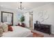 Bright main bedroom featuring a barn door, contemporary lighting, and stylish furniture at 21032 N 58Th St, Phoenix, AZ 85054