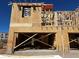 This is a new house under construction with wood framing and sheathing, showcasing modern architectural design at 21032 N 58Th St, Phoenix, AZ 85054