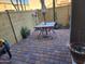 Inviting backyard featuring a patio, brick flooring, and an outdoor dining area at 2150 E Bell Rd # 1048, Phoenix, AZ 85022