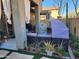 Cozy backyard featuring comfortable seating, a BBQ, and a variety of lush plants at 2150 E Bell Rd # 1048, Phoenix, AZ 85022