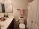 Cozy bathroom featuring neutral tones, a shower curtain, and a decorative mirror at 2150 E Bell Rd # 1048, Phoenix, AZ 85022