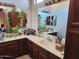 Bathroom with a double vanity, large mirrors, and leafy plants adding a touch of nature at 2150 E Bell Rd # 1048, Phoenix, AZ 85022