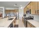 Well-equipped kitchen featuring modern appliances, a large island, and ample cabinet space at 21757 S 191St Pl, Queen Creek, AZ 85142