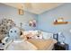 Bedroom featuring a full bed covered in plush stuffed animals under a ceiling fan at 2202 N Los Altos Dr, Chandler, AZ 85224