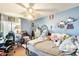 Bright bedroom features a ceiling fan, window and comfortable decorations for a personalized space at 2202 N Los Altos Dr, Chandler, AZ 85224