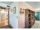 Inviting entryway features neutral colors, decorative shelving, and a glimpse into other rooms at 2202 N Los Altos Dr, Chandler, AZ 85224