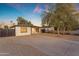 Charming single-story home with desert landscaping, concrete driveway, and a bright blue-green front door at 2209 N 23Rd St, Phoenix, AZ 85006