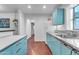 Functional vintage kitchen with turquoise cabinets, stainless counters and plenty of storage at 2209 N 23Rd St, Phoenix, AZ 85006