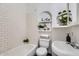 Charming bathroom features a tub with subway tile, stylish fixtures and vintage charm at 2209 N 8Th St, Phoenix, AZ 85006