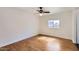 Bright bedroom features hardwood floors, a ceiling fan and natural lighting from the window at 2209 N 8Th St, Phoenix, AZ 85006