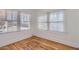 Bright bedroom with two large windows and original hardwood floors at 2209 N 8Th St, Phoenix, AZ 85006