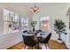 Sunlit dining room with a sleek round table and ample space for entertaining at 2209 N 8Th St, Phoenix, AZ 85006