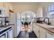 Well-lit kitchen featuring white cabinets, wood countertops, and access to the dining area at 2209 N 8Th St, Phoenix, AZ 85006