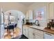 Charming kitchen with white cabinetry, butcher block countertops, and modern fixtures at 2209 N 8Th St, Phoenix, AZ 85006