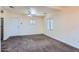 Living room with plush carpeting, a ceiling fan and natural lighting at 2209 N 8Th St, Phoenix, AZ 85006