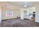 Cozy living room connected to kitchen with plush carpet and natural lighting at 2209 N 8Th St, Phoenix, AZ 85006