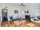 Cozy living room featuring a decorative fireplace, hardwood floors, and comfortable seating at 2209 N 8Th St, Phoenix, AZ 85006