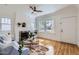 Bright living room with a brick fireplace, hardwood floors, and natural light at 2209 N 8Th St, Phoenix, AZ 85006