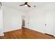 Hardwood floors brighten this bedroom featuring neutral walls, ceiling fan, and ample closet space at 2237 N 9Th St, Phoenix, AZ 85006