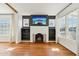 Bright living room featuring a fireplace, hardwood floors, and built-in shelving at 2237 N 9Th St, Phoenix, AZ 85006