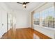 Spacious living room featuring hardwood floors, white walls, and a large window with natural light at 2237 N 9Th St, Phoenix, AZ 85006