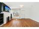 Well-lit living room featuring a fireplace, hardwood floors, and bright windows at 2237 N 9Th St, Phoenix, AZ 85006