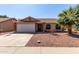 Charming single story home with a two car garage, desert landscaping, and appealing curb appeal at 2251 E Remington Pl, Chandler, AZ 85286