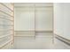 Walk-in closet featuring custom shelving and metal hanging rods at 2263 E Mariposa Grande --, Phoenix, AZ 85024