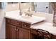 Bathroom vanity features a built-in make up counter, neutral countertop and wood cabinetry at 23318 N Las Positas Ct, Sun City West, AZ 85375